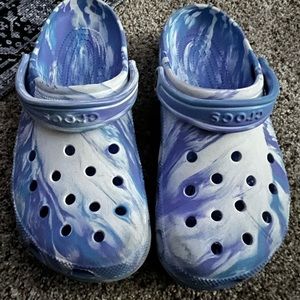 Women’s size 11 tie dyed crocs. New condition. Smoke free pet free home.